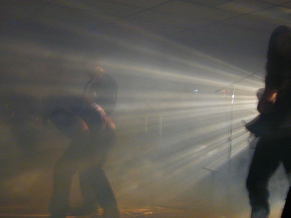 Dark Days on stage through beams and fog