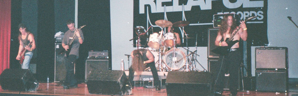 Dark Days on the main stage at the Milwaukee Metalfest, 1999 — full band with Daryl Parvin on bass, Relapse Records banner behind
